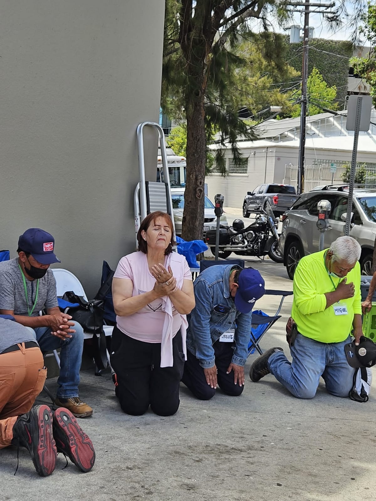 Church members praying on the street